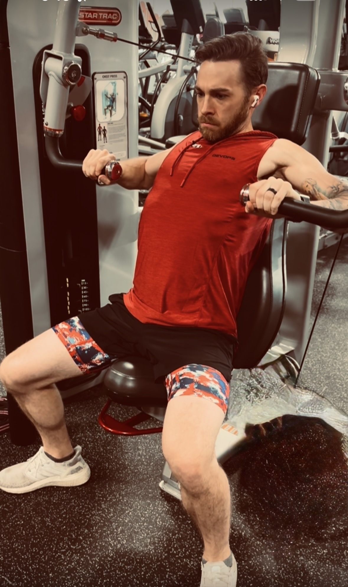 Coach D working a seated row machine